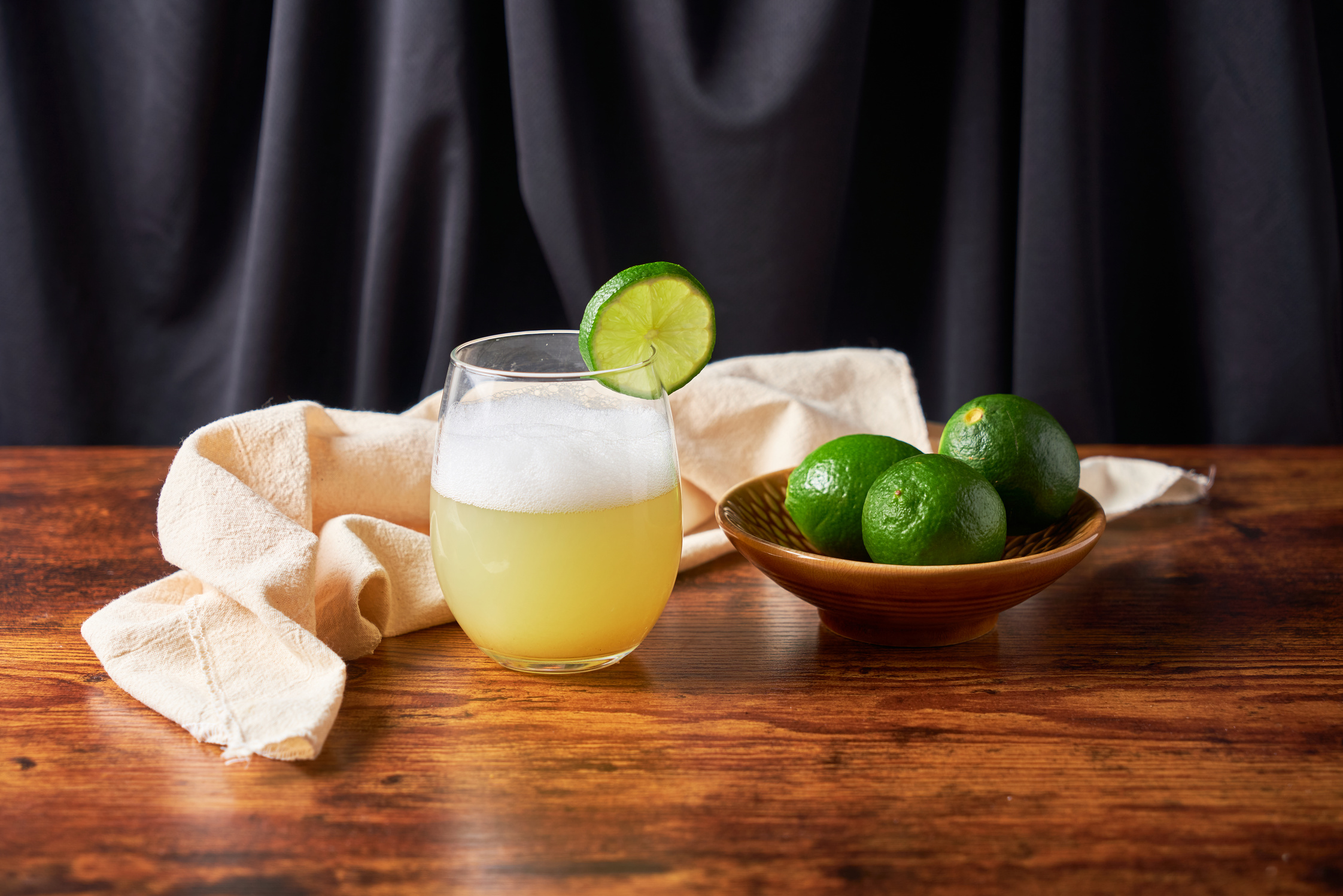 Homemade Pisco Sour Cocktail with Lime and Bitters